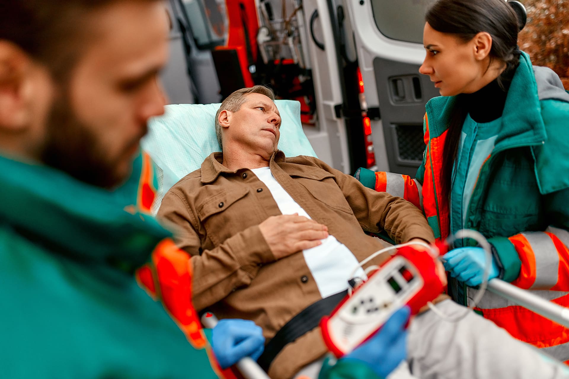 Paramedics check the level of oxygen in the blood and transport